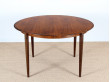 Extendable round dining table in rosewood, 4/8 seats.