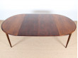 Extendable round dining table in rosewood, 4/8 seats.