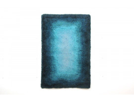 Rya rugs in wool with blue concentric motifs.