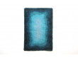 Rya rugs in wool with blue concentric motifs.