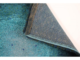 Rya rugs in wool with blue concentric motifs.