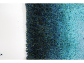 Rya rugs in wool with blue concentric motifs.