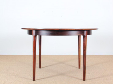 Mid-Century Modern danish extendable round dining table in Rio rosewood. 